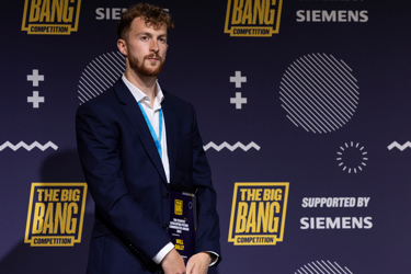 Will Dally, winner of the Stantec Helping Future Communities Award in the 2024 Big Bang Competition, standing with his award.