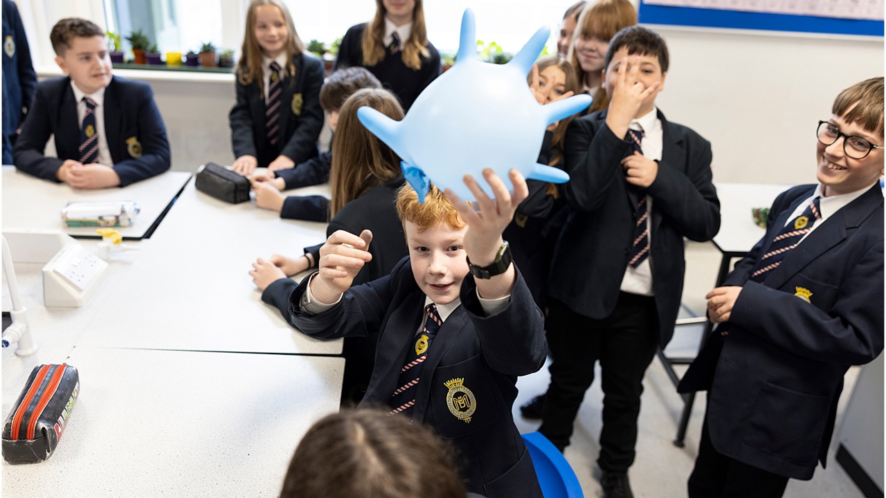 A group of young people at school doing a science experiment 