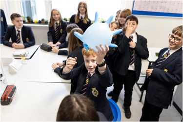 A group of young people at school doing a science experiment