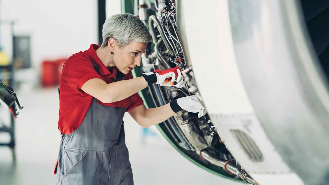 STEM professional working on engine