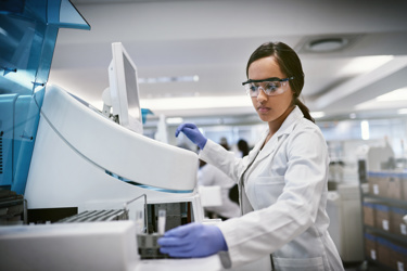 A scientist in a lab, working 