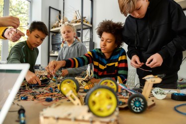 Primary school children making an electric model car