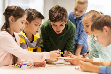 Students playing with robot