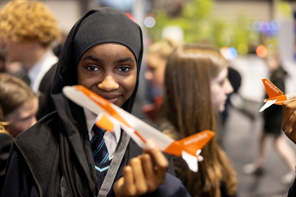 A young person interacts with exhibits and stands and activities at The Big Bang Fair