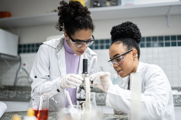 Scientists in a lab surrounded by equipment