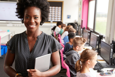 A female teacher in a primary school classroom